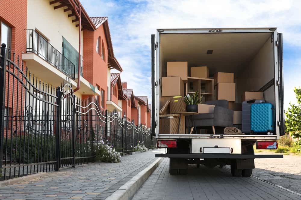 back of moving truck full of furniture and boxes.