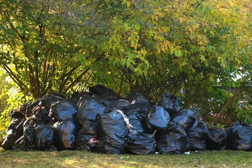 large pile of black garbage bags.