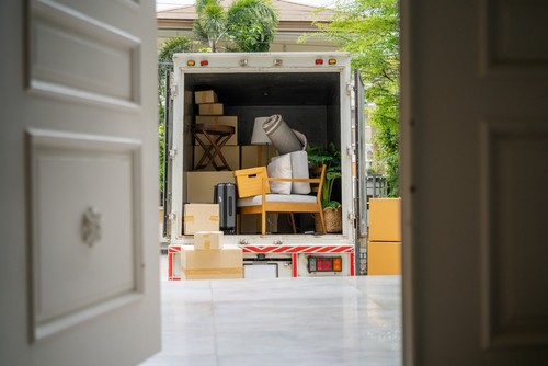 back of truck full of furniture.